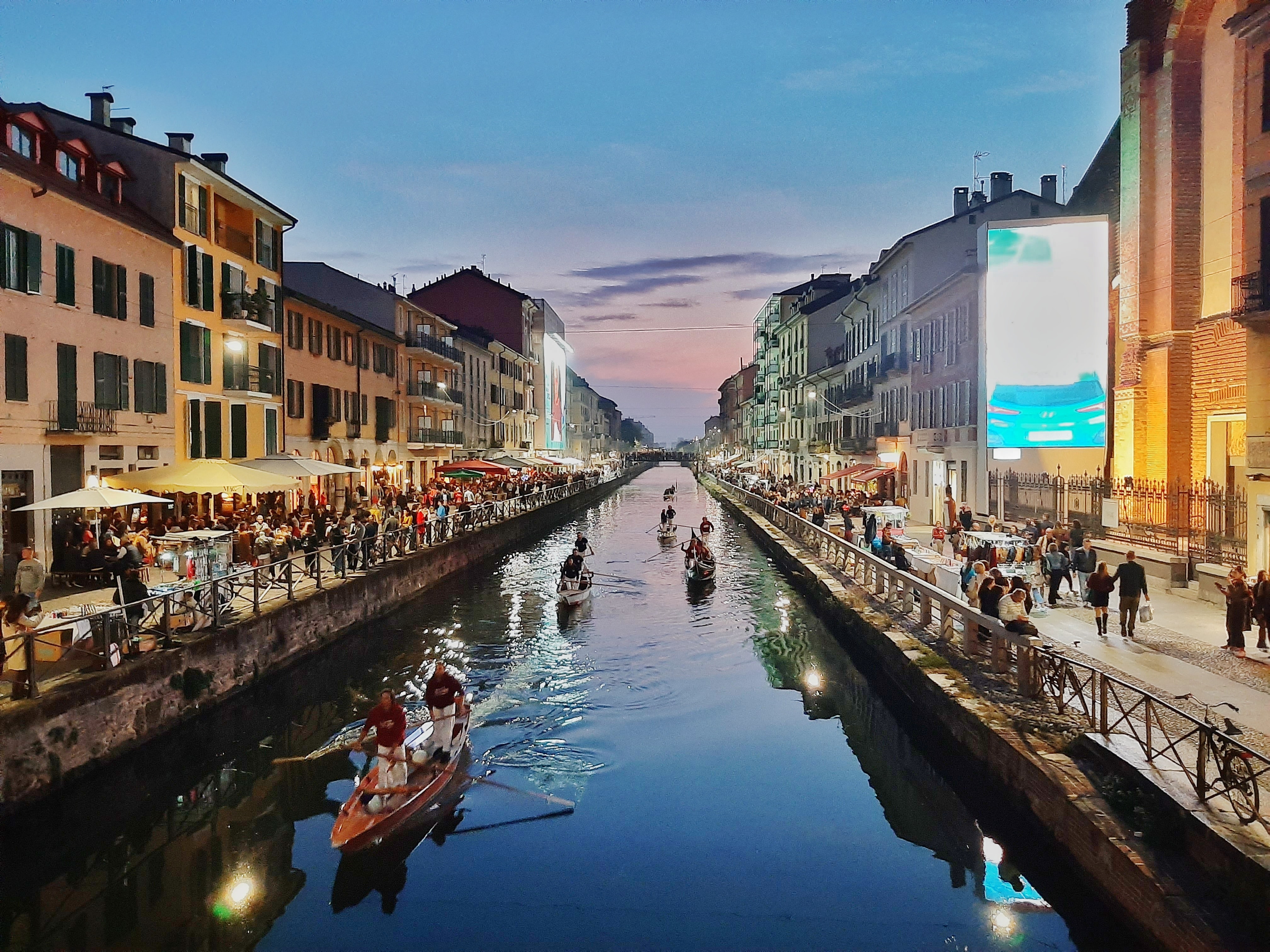 A picture of a river in Milan at dusk.