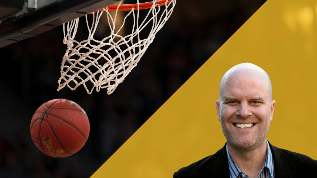 Portrait of Andrew Maraniss with a basketball falling through a hoop in the background.