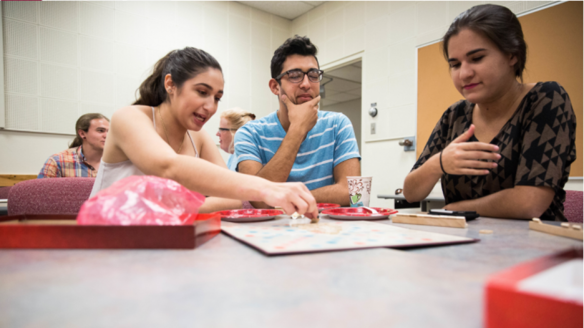 Students enjoying snacks and games at the SILC Café.