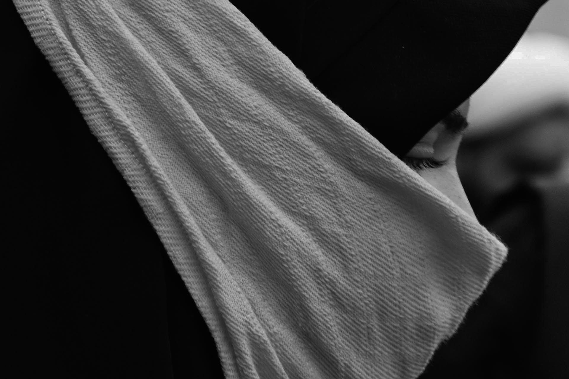 A Muslim woman looking down.