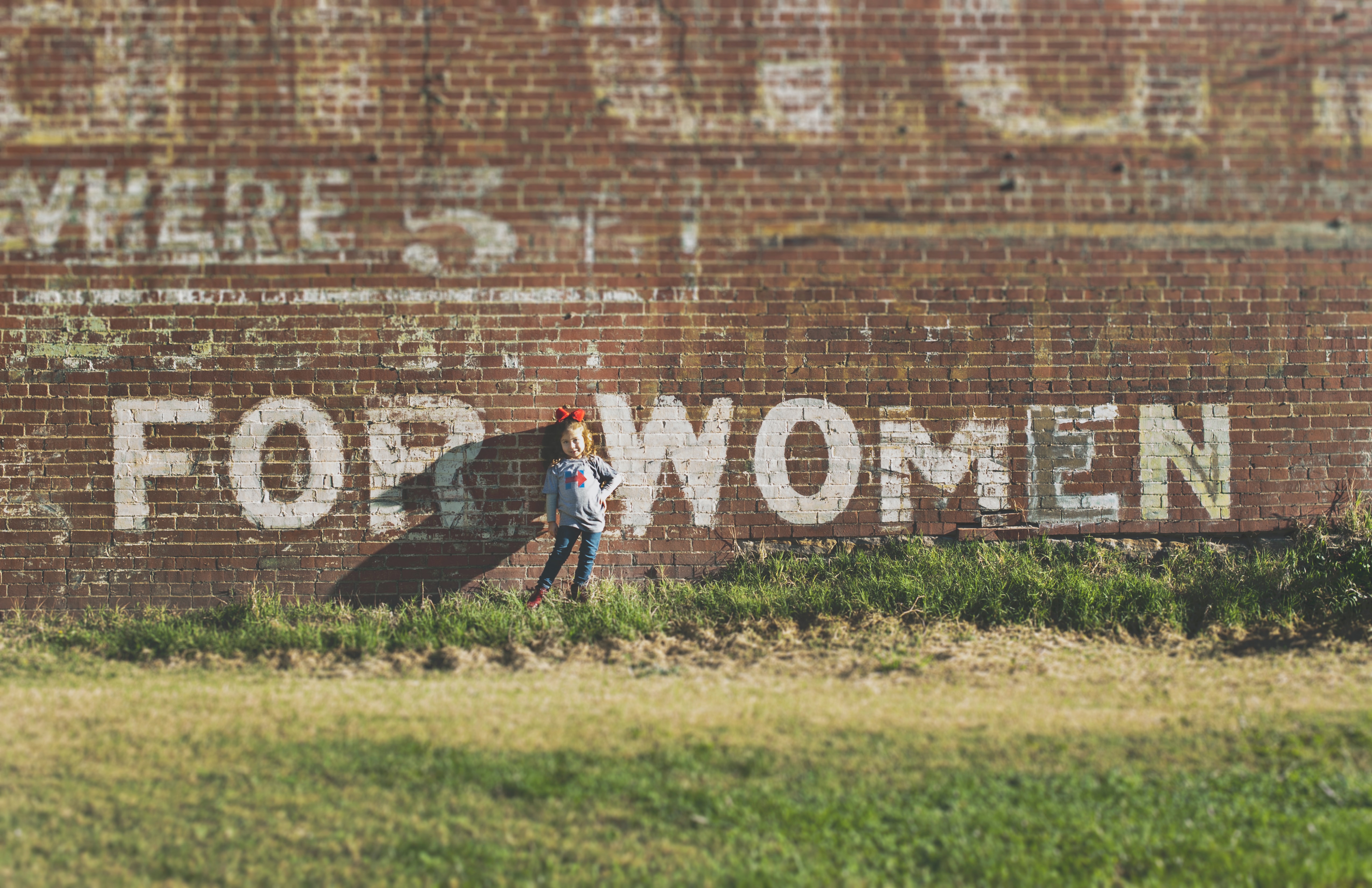 Brick wall with graffiti "for women"
