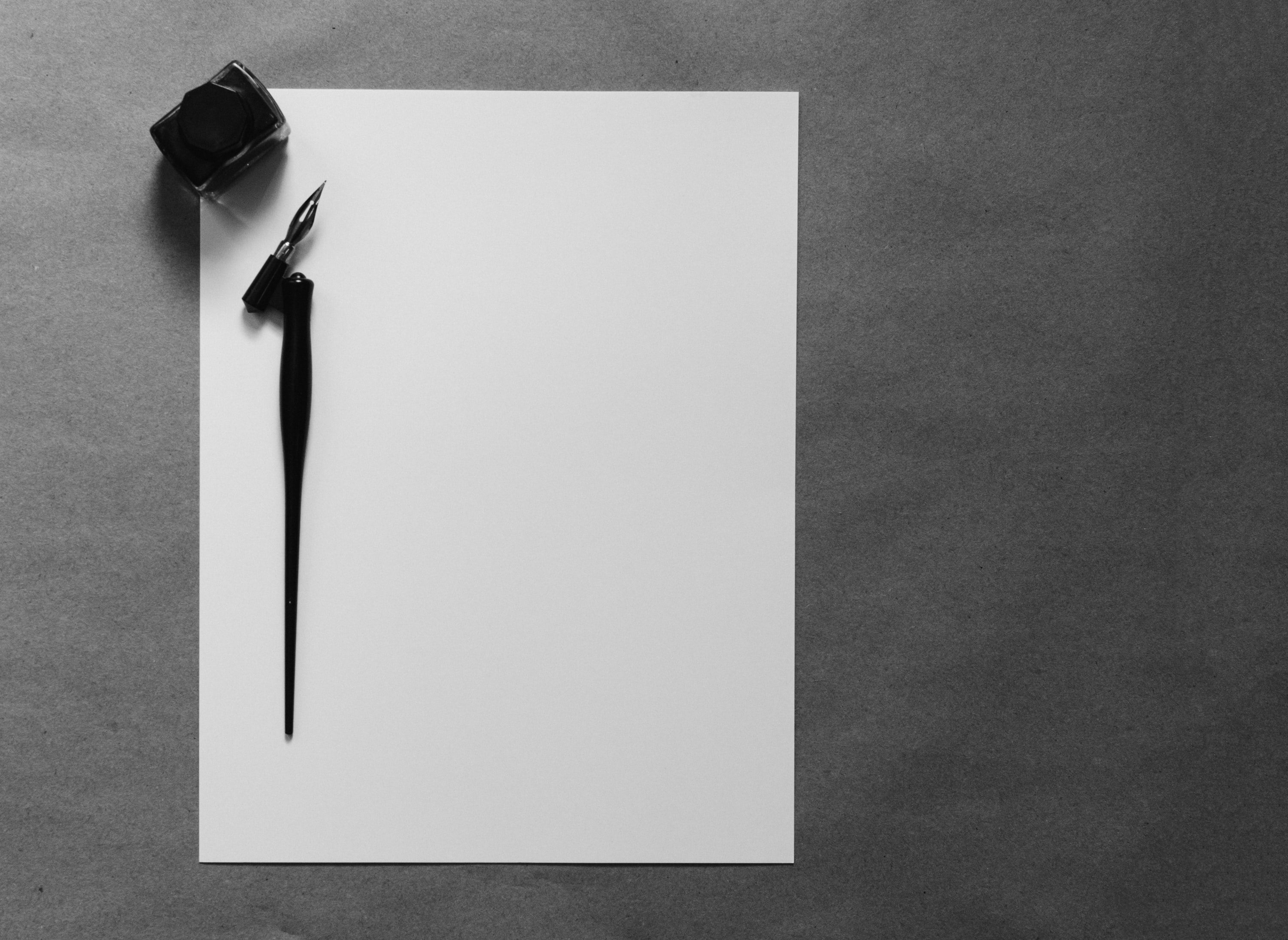 Pen and paper with dripping ink