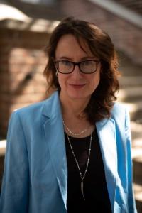 Portrait photo of Emily Wilson, smiling looking towards the camera